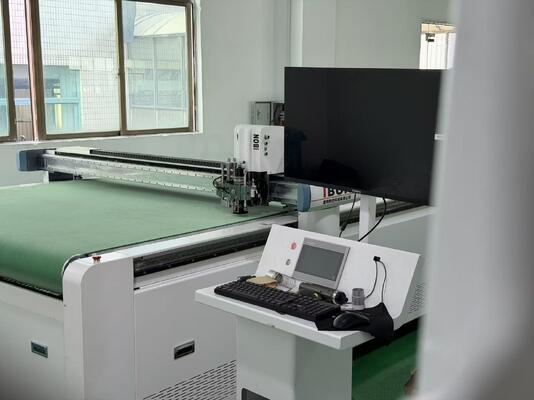 CNC corrugated box cutting machine with knife cutting and creasing tools. No die needed. High precision for carton & packaging boxes.